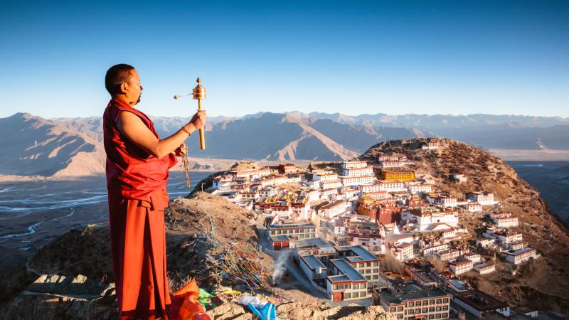 Buddhist monk praying, Ganden monastery, Tibet