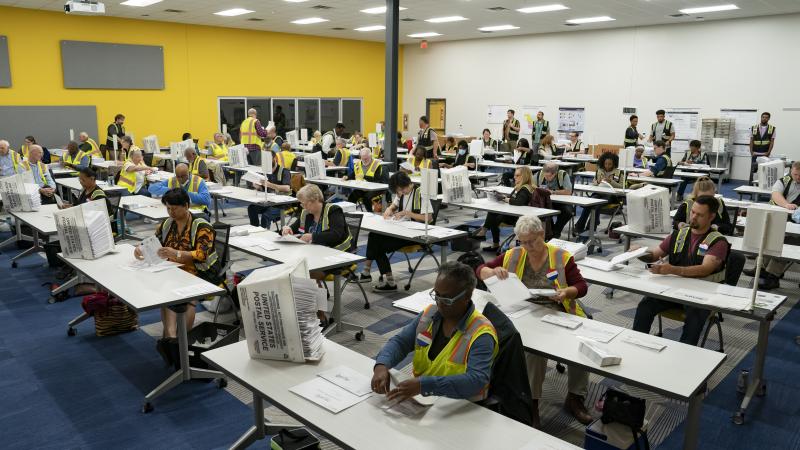 Absentee ballots are prepared to be mailed at the Wake County Board of Elections on September 17, 2024 in Raleigh, North Carolina.