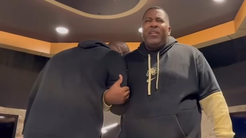 University of Colorado football coach Deion Sanders with pastor E. Dewey Smith in Buffaloes locker room