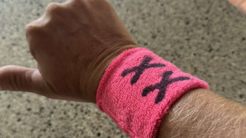 XX wristband worn by parents to protest transgender sports policy
