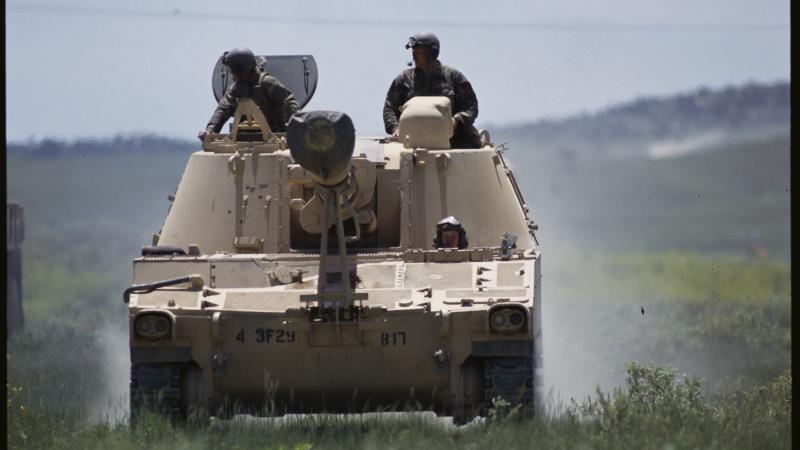 Carson County, Idaho: National Guard trains with U. S. Army-155 MM artillery.
