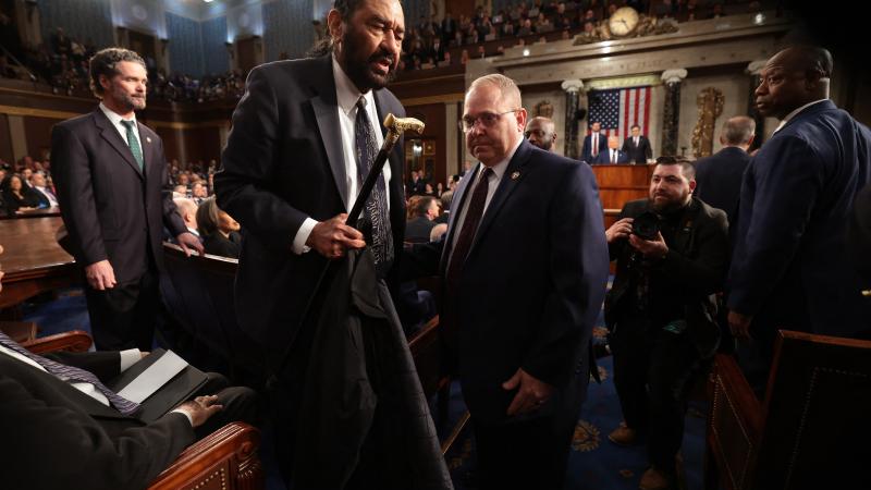 US Representative Al Green (D-TX) is removed from the chamber after shouting out as US President Donald Trump speaks during an address to a joint session of Congress at the US Capitol in Washington, DC, on March 4, 2025.