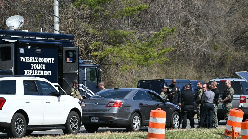 Law enforcement waiting outside the CIA headquarters in Langley, Va.
