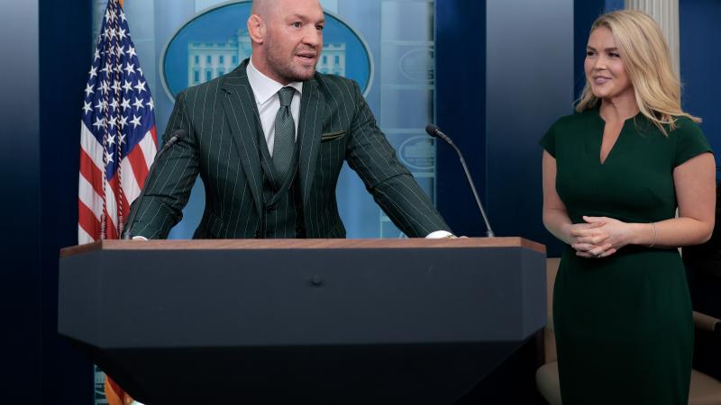 Former UFC champion and Irish businessman Conor McGregor briefly speaks with reporters alongside White House Press Secretary Karoline Leavitt before meeting with President Donald Trump