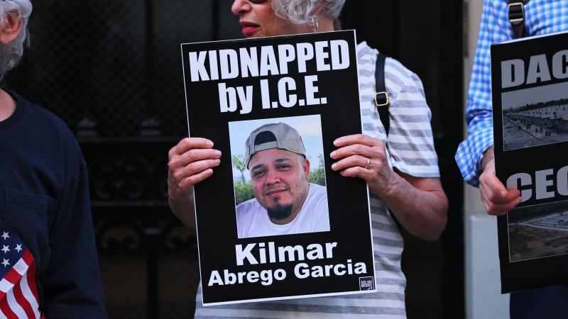 A protester holds a photo of Maryland man Kilmar Abrego Garcia as demonstrators gather to protest against the deportation of immigrants to El Salvador outside the Permanent Mission of El Salvador to the United Nations on April 24, 2025 in New York City.