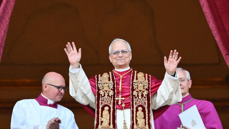 Newly elected Pope Leo XIV, Robert Francis Prevost arrives on the main central loggia balcony of the St Peter's Basilica for the first time, after the cardinals ended the conclave, in The Vatican, on May 8, 2025