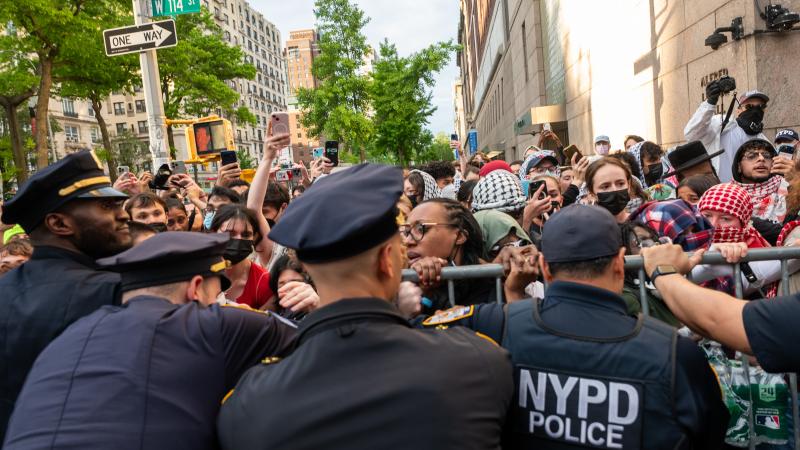 Police push back protesters as they gather outside of Columbia University's Butler Library after pro-Palestinian protesters occupied the space on May 07, 2025 in New York City.