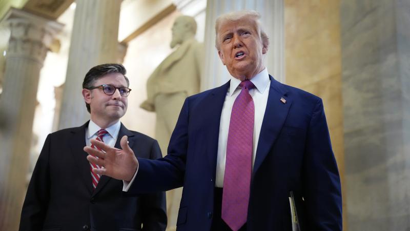 President Donald Trump arrives with Speaker of the House Mike Johnson (R-LA) for a House Republican meeting at the U.S. Capitol on May 20, 2025 in Washington, DC.