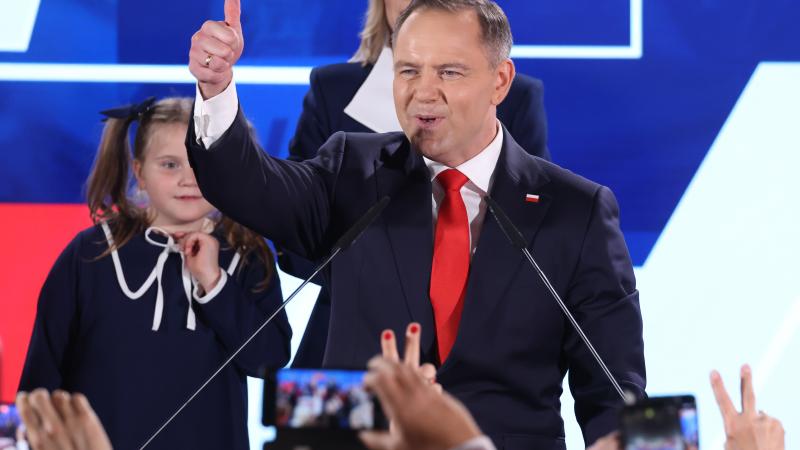 Karol Nawrocki, presidential candidate of the Law and Justice Party (PiS), gestures to supporters following the Polish presidential runoff election on June 01, 2025 in Warsaw, Poland.