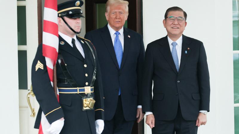 U.S. President Donald Trump greets Japan's Prime Minister Shigeru Ishiba at the White House in Washington, D.C. on February 7, 2025.