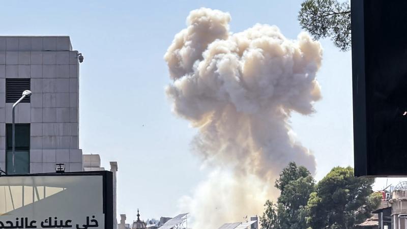Smoke billows following Israeli strikes near the Syrian army and defence ministry headquarters in Damascus on July 16, 2025
