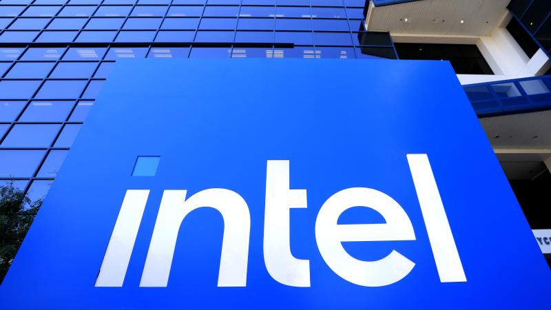 The Intel logo is displayed on a sign in front of Intel headquarters on July 16, 2025 in Santa Clara, California