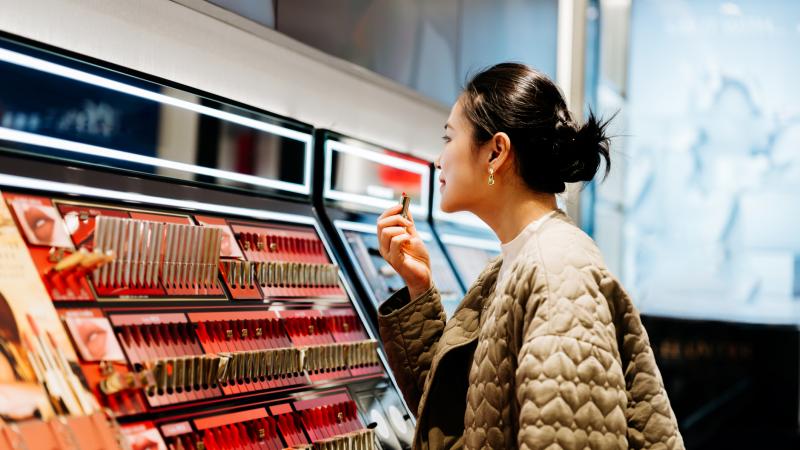 Woman looking at cosmetics 