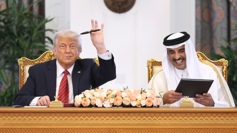 DOHA, QATAR - MAY 14: U.S. President Donald J. Trump and Emir of Qatar Tamim bin Hamad al Thani attend a signing ceremony at the Amiri Diwan, the official workplace of the emir, on May 14, 2025, in Doha, Qatar.