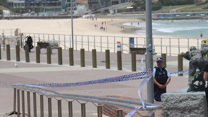 Police set up a cordon line at the scene of a mass shooting at Bondi Beach on December 15, 2025 in Sydney, Australia.