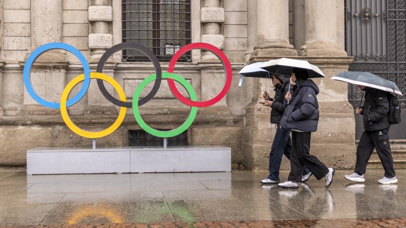Olympics MILANO, ITALY - JANUARY 28: Visitors walk past the Olympic Rings
