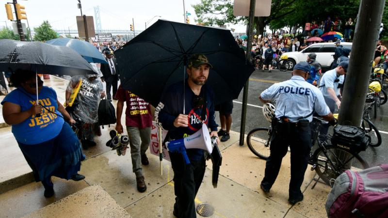Pastor Aden Rusfeldt protesting at Pride Parade