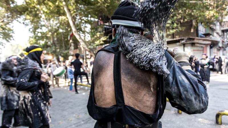 ranian men flog themselves with chain on the day of Ashura the climax day of the Mourning of Muharram religious holiday in Khorramabad, Iran on September 20, 2018. 
