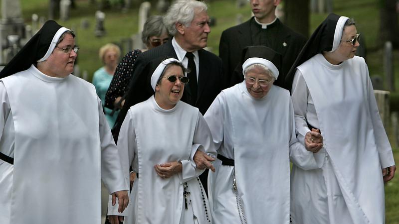 Dominican Sisters of Hawthorne at the reinterment of Nathaniel Hawthorne's wife and daughter to Sleepy Hollow Cemetery in an antique horse drawn hearse that carries the lone casket. 