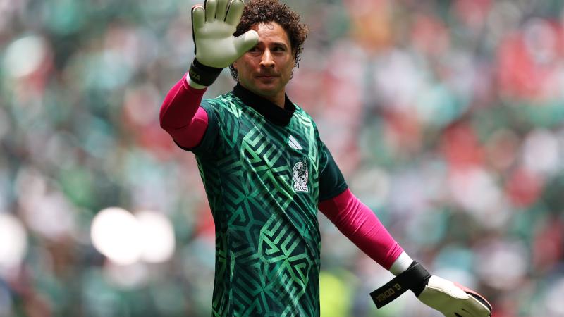 Guillermo Ochoa waves at fans