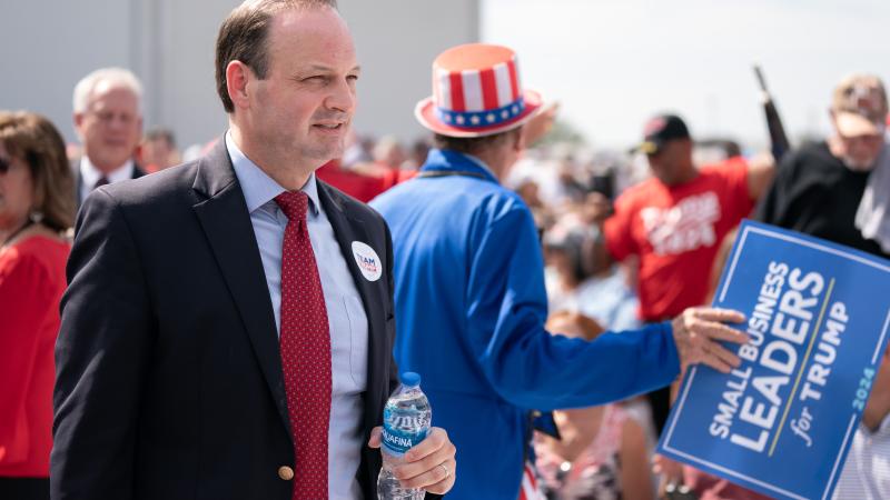 South Carolina Attorney General Alan Wilson takes his seat during a Trump rally on Sept. 25, 2023 in Summerville, South Carolina.