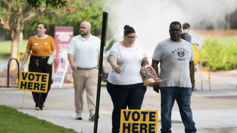 Voters leave a polling location in Columbia, South Carolina, on May 26.