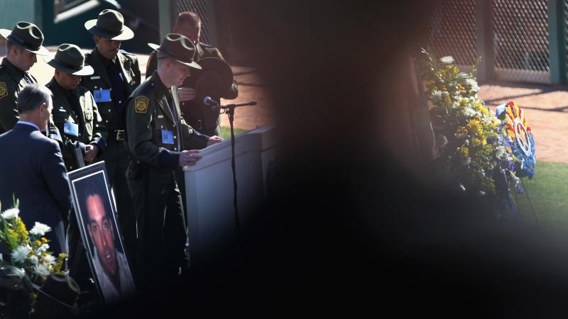 U.S. Border Patrol chaplain Mark Vander Lee says a prayer during a memorial service for slain Border Patrol agent Brian Terry on January 21, 2011 in Tucson, Arizona. 