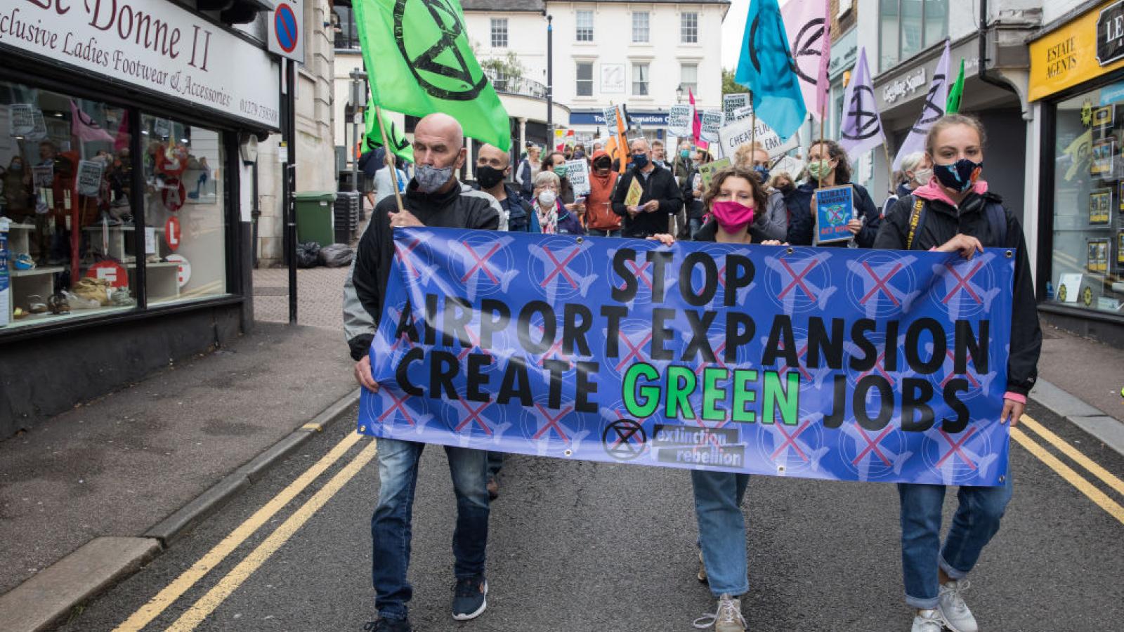 Climate activists from Extinction Rebellion attend a protest against the expansion of Stansted Airport on 29 August 2020 in Bishop's Stortford, United Kingdom.