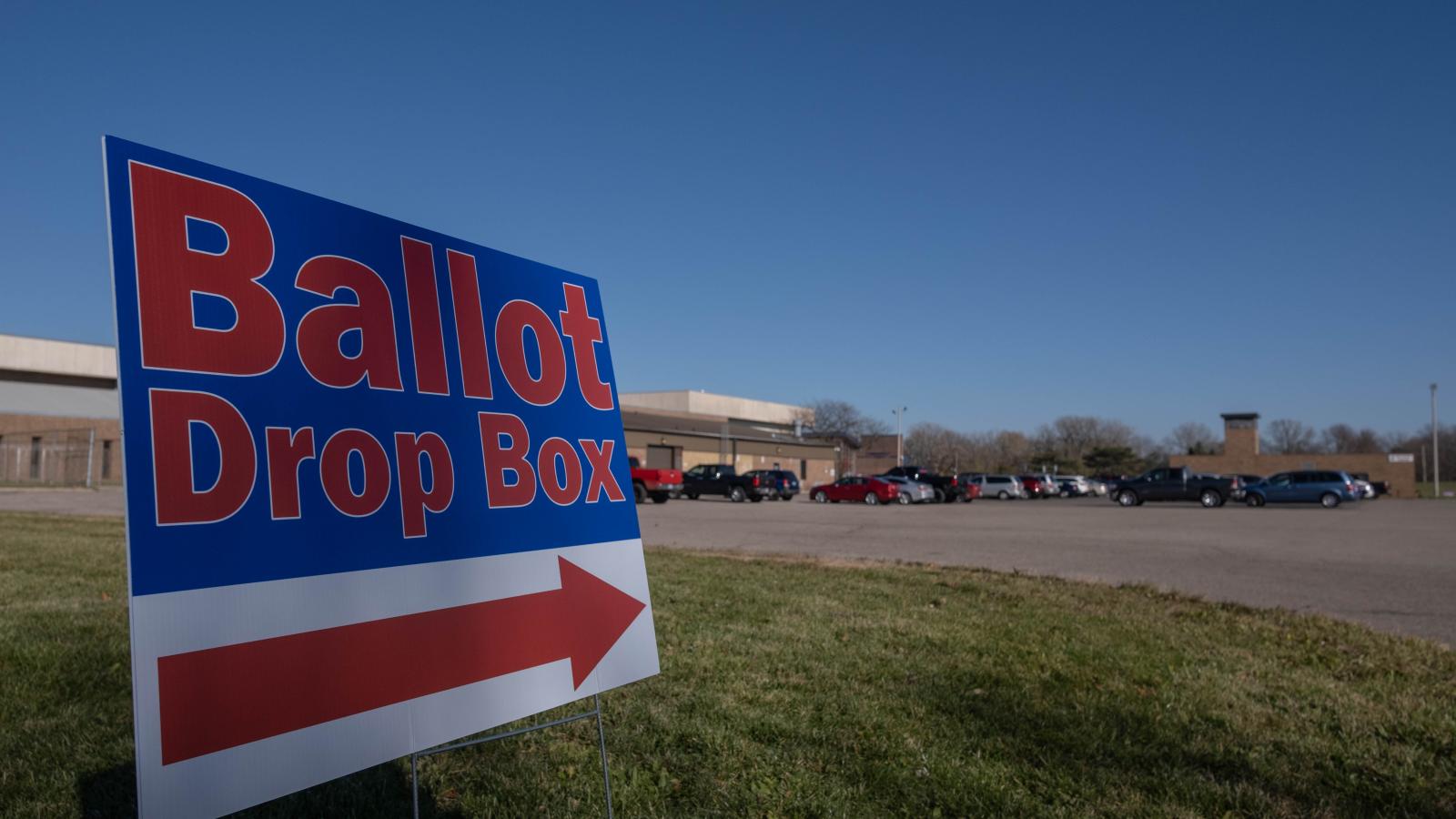 A sign pointing in the direction of a ballot drop boxes in Lansing, Michigan at Schmidt Community Center a polling station in Lansing, Michigan November 3,2020.
