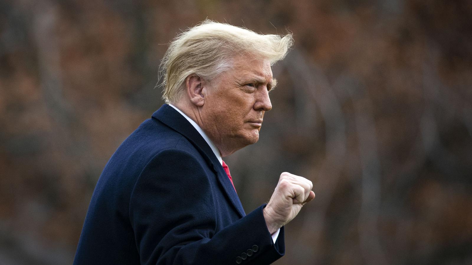 U.S. President Donald Trump pumps his fist as he departs on the South Lawn of the White House, on December 12, 2020 in Washington, DC.