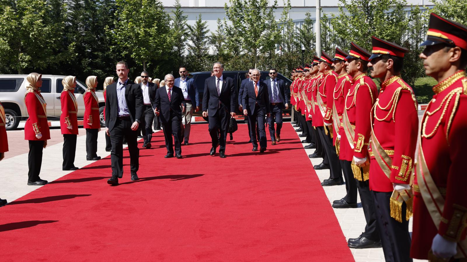 Mike Pompeo arriving at MEK HQ