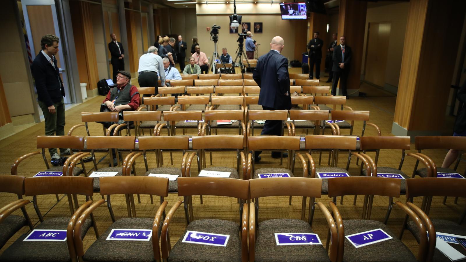 Seats for major media outlets are reserved prior to a press conference