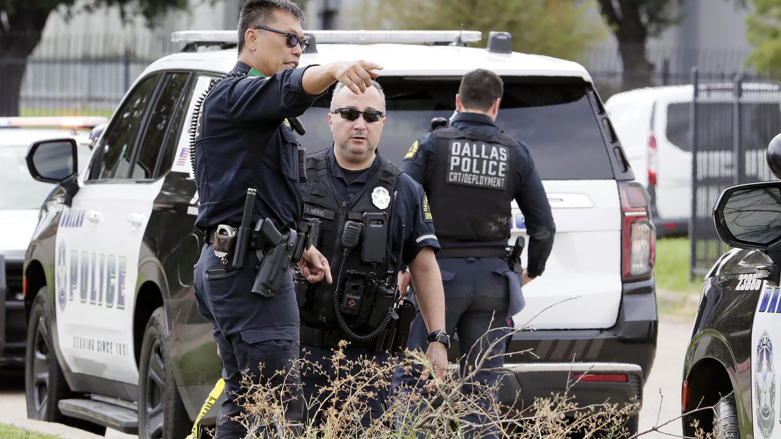 DALLAS, TEXAS - SEPTEMBER 24: Dallas Police investigate the scene where a shooter opened fire on a U.S. Immigration and Customs Enforcement facility, September 24, 2025 in Dallas, Texas. Two detainees were killed, and one was wounded after being shot from a rooftop, before the shooter died of a self-inflicted gunshot.